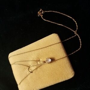 Crystal heart pendant with 10kt gold on a 10 kt gold 17 inch chain necklace.